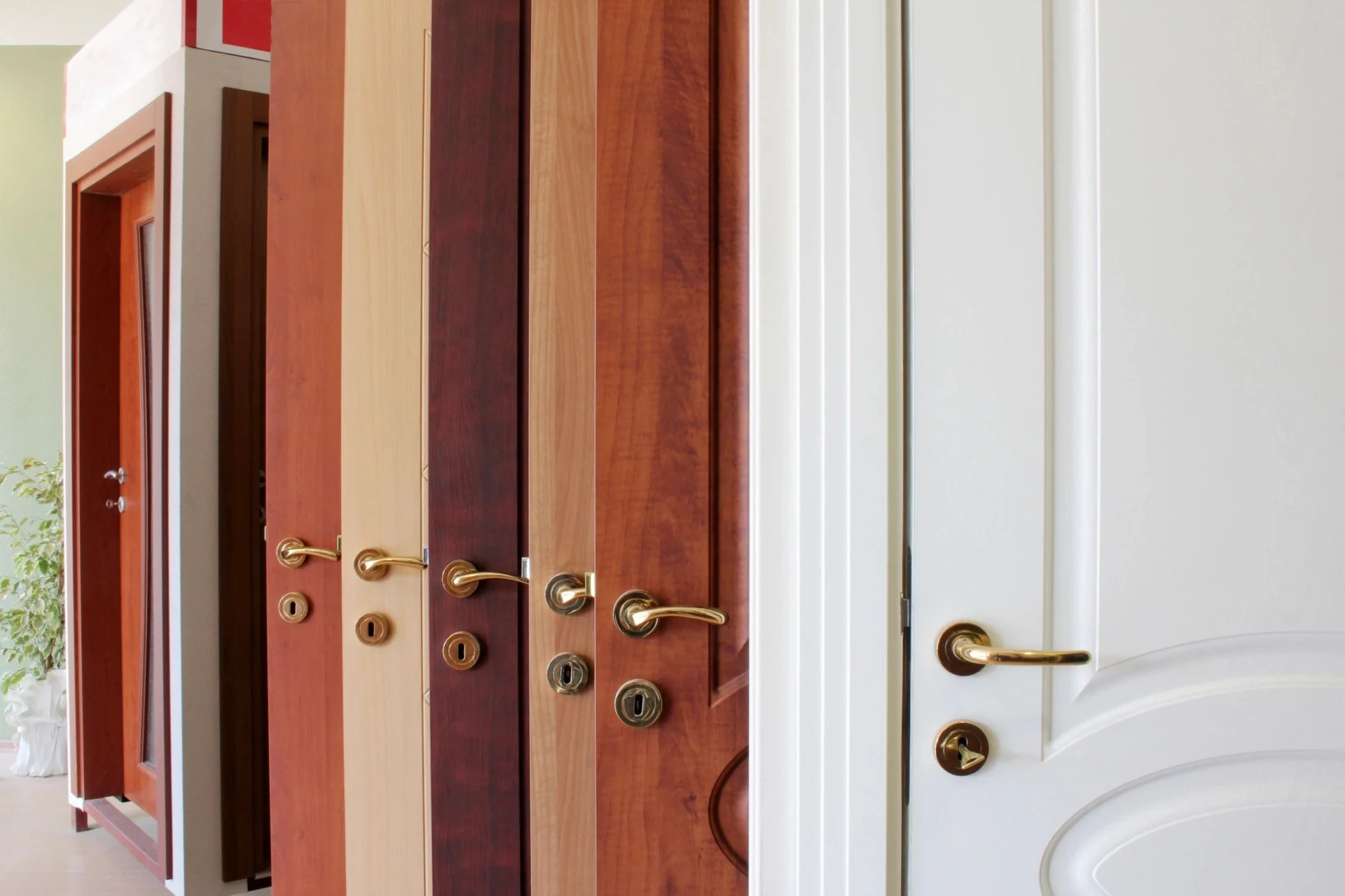 A row of doors with different wood colors.